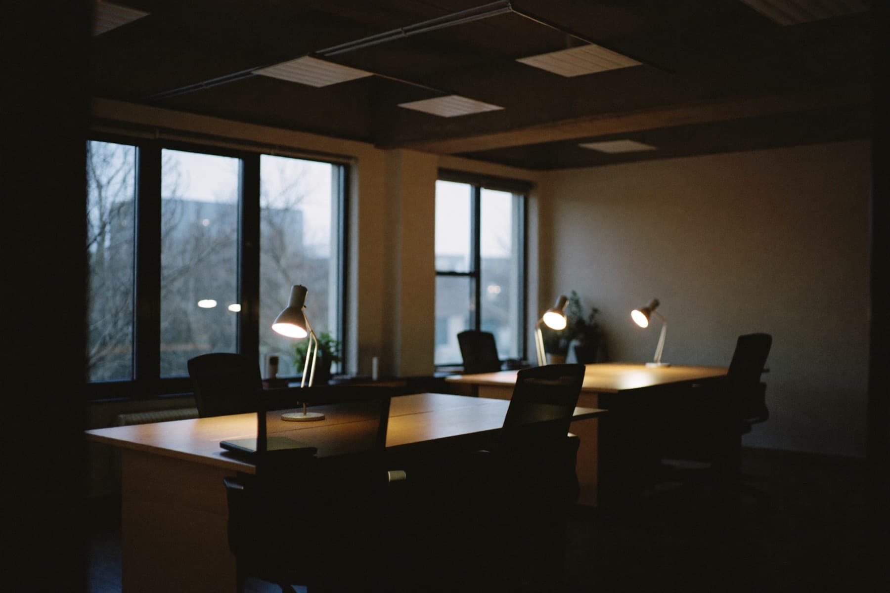 A small office workspace at dusk